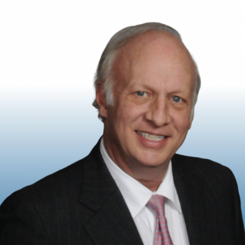 Equity team member in a dark suit with a patterned tie, smiling warmly